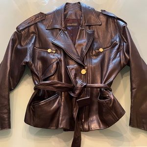 Vintage Donna Karan real leather moto jacket. 2 pocket, belted with epaulets.